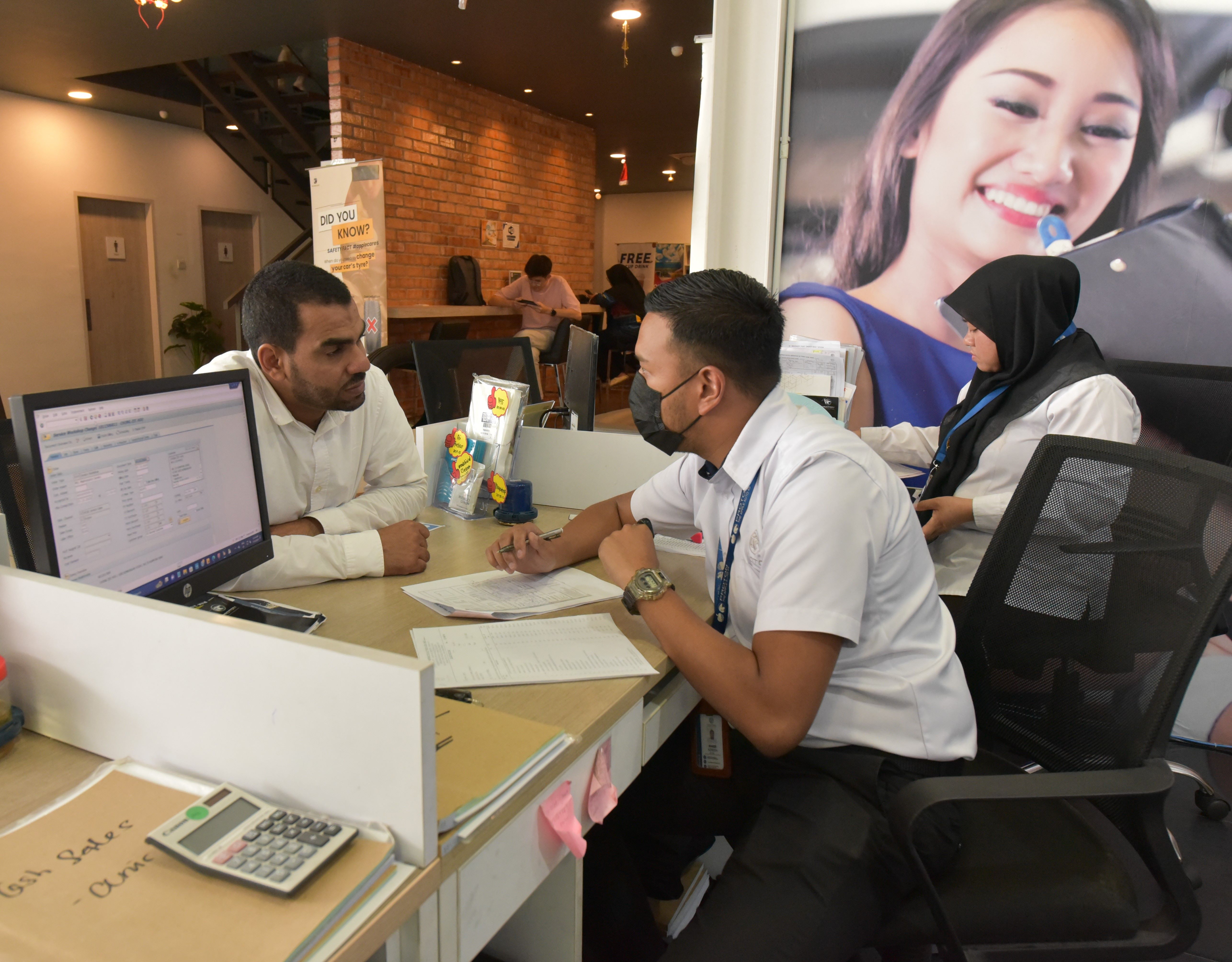 service-consultant-attends-to-customers-enquiries